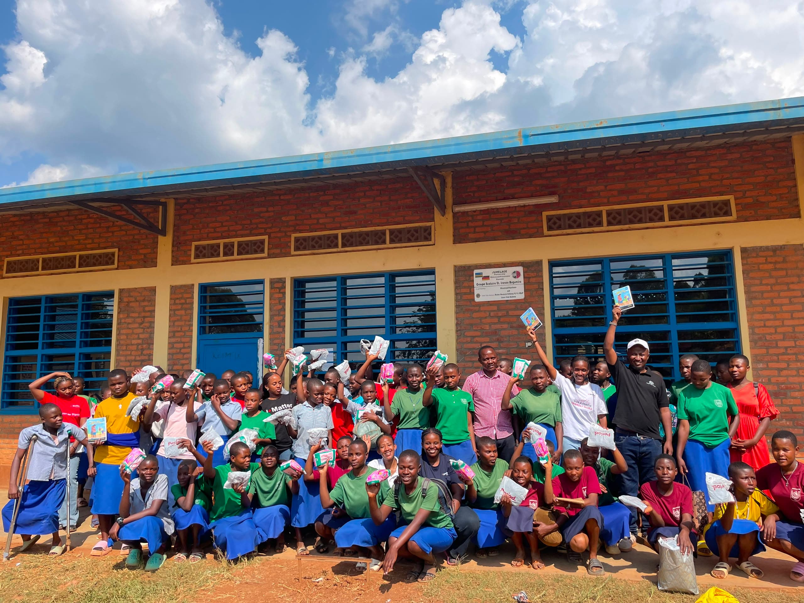Children with books supported by the Cyiza Foundation
